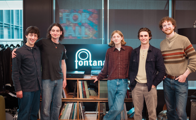 Members of Curiosity Shop pose after signing to Fontana